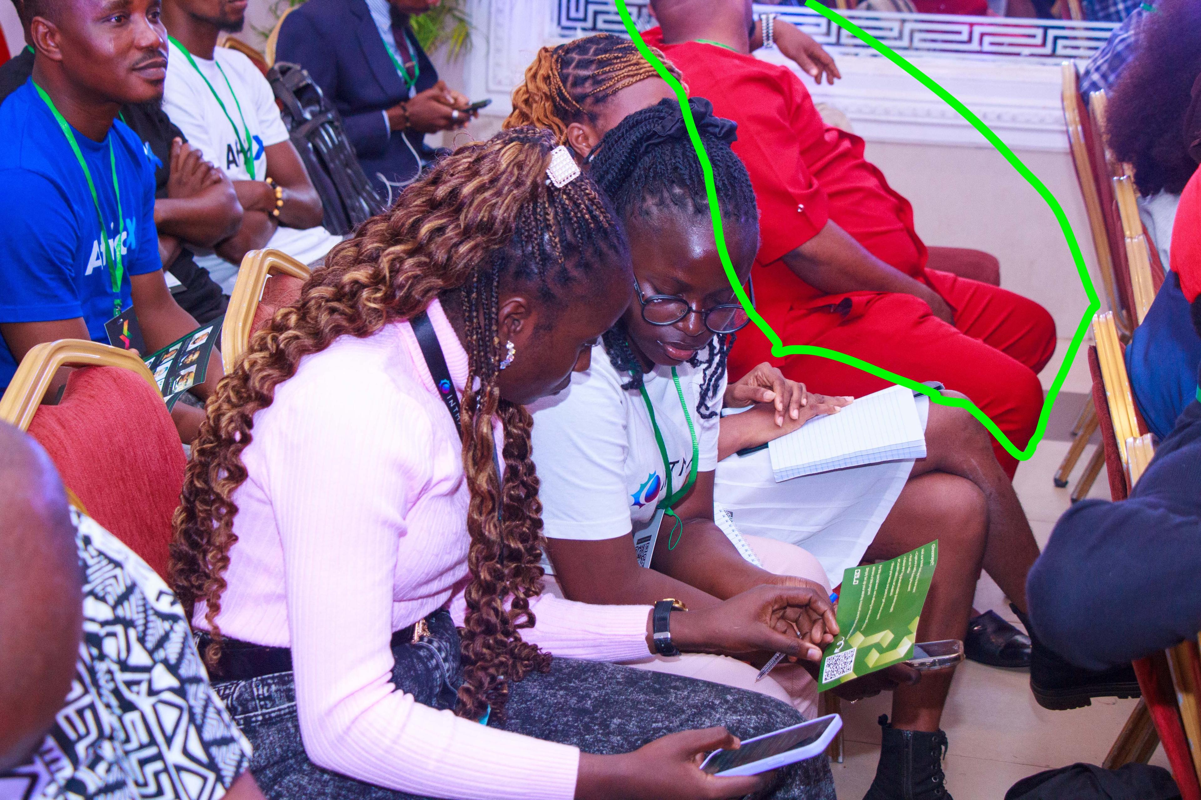 Attendees engaging with conference materials